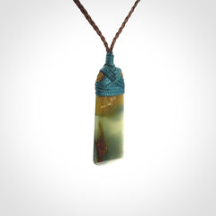 A beautiful, small, New Zealand jade toki pendant
