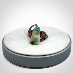 A beautiful, small, New Zealand jade toki pendant