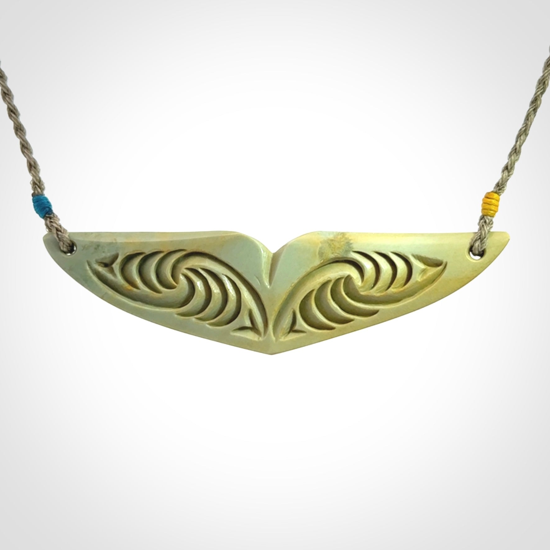 Hand carved New Zealand Flower Jade whale tail pendant