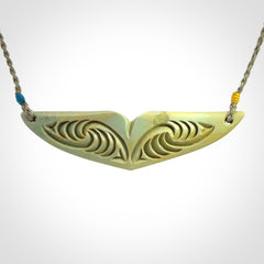 Hand carved New Zealand Flower Jade whale tail pendant