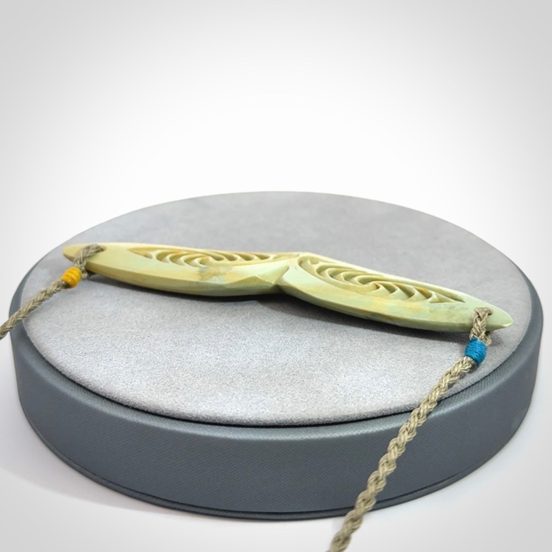 Hand carved New Zealand Flower Jade whale tail pendant