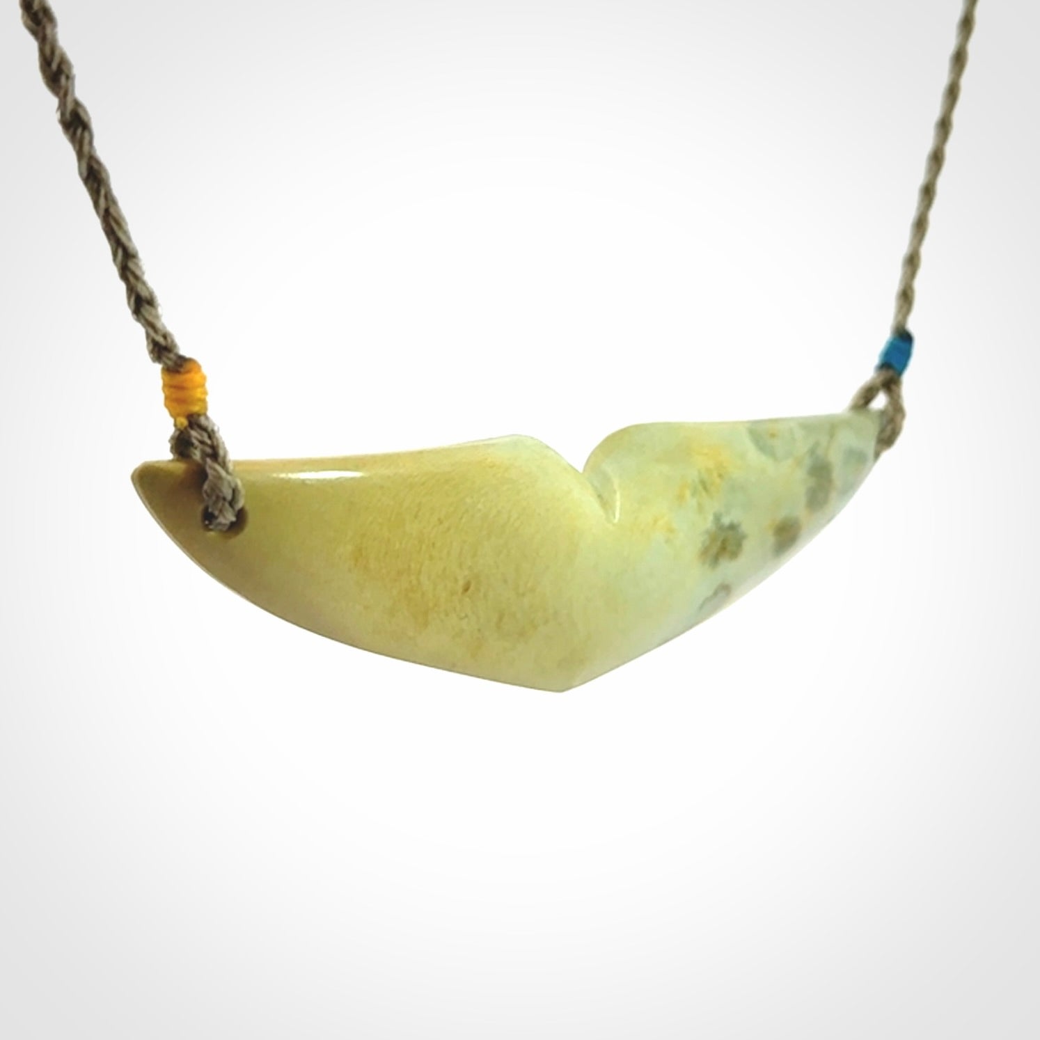 Hand carved New Zealand Flower Jade whale tail pendant