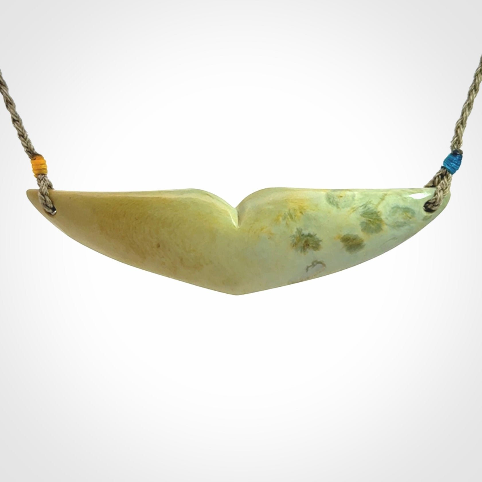 Hand carved New Zealand Flower Jade whale tail pendant