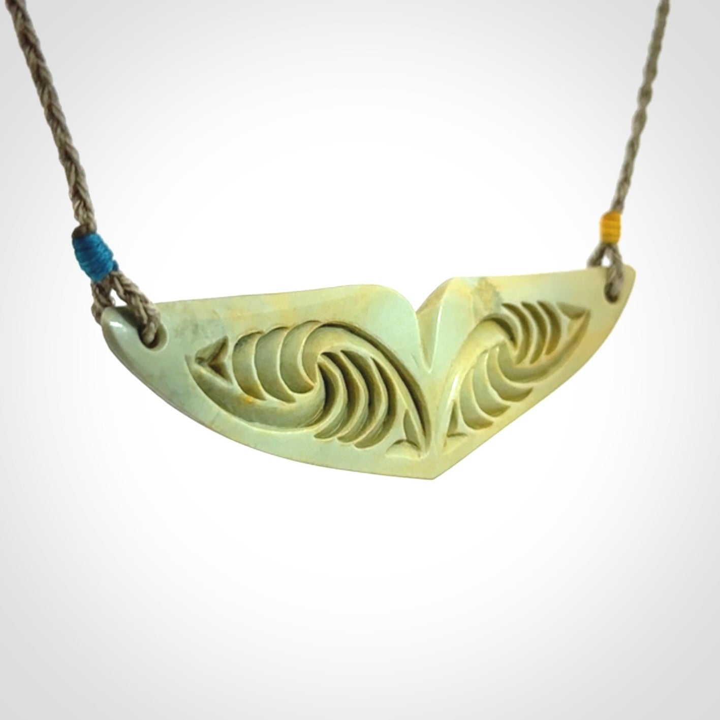 Hand carved New Zealand Flower Jade whale tail pendant