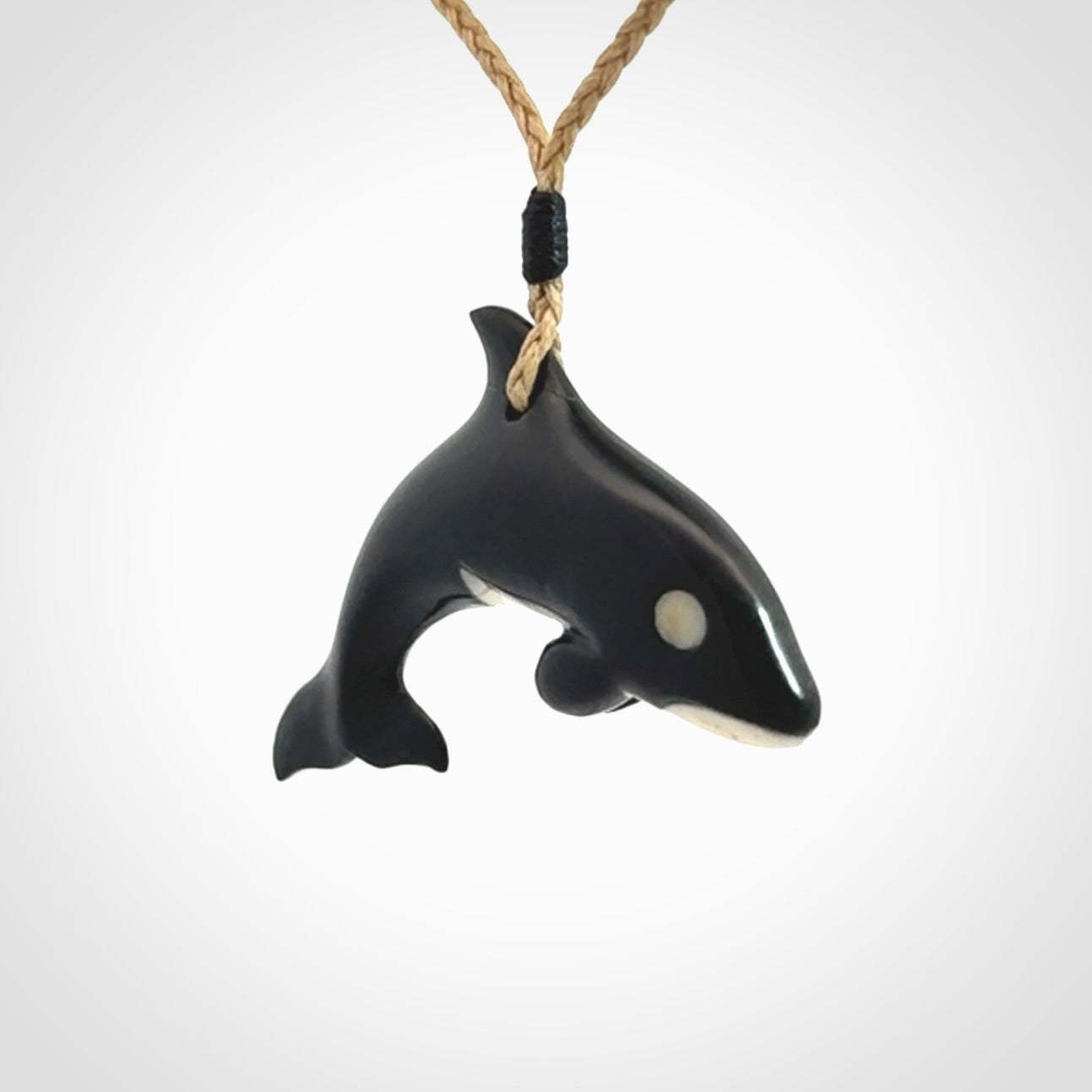 Hand carved black jade and bone Orca pendant. Ocean themed pendants hand carved from natural materials by NZ Pacific. Unique handmade jewellery.