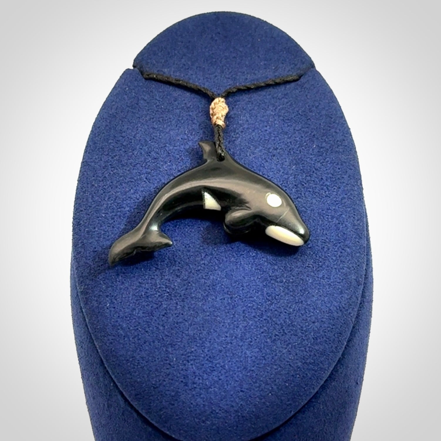Hand carved black jade and bone Orca pendant. Ocean themed pendants hand carved from natural materials by NZ Pacific. Unique handmade jewellery.