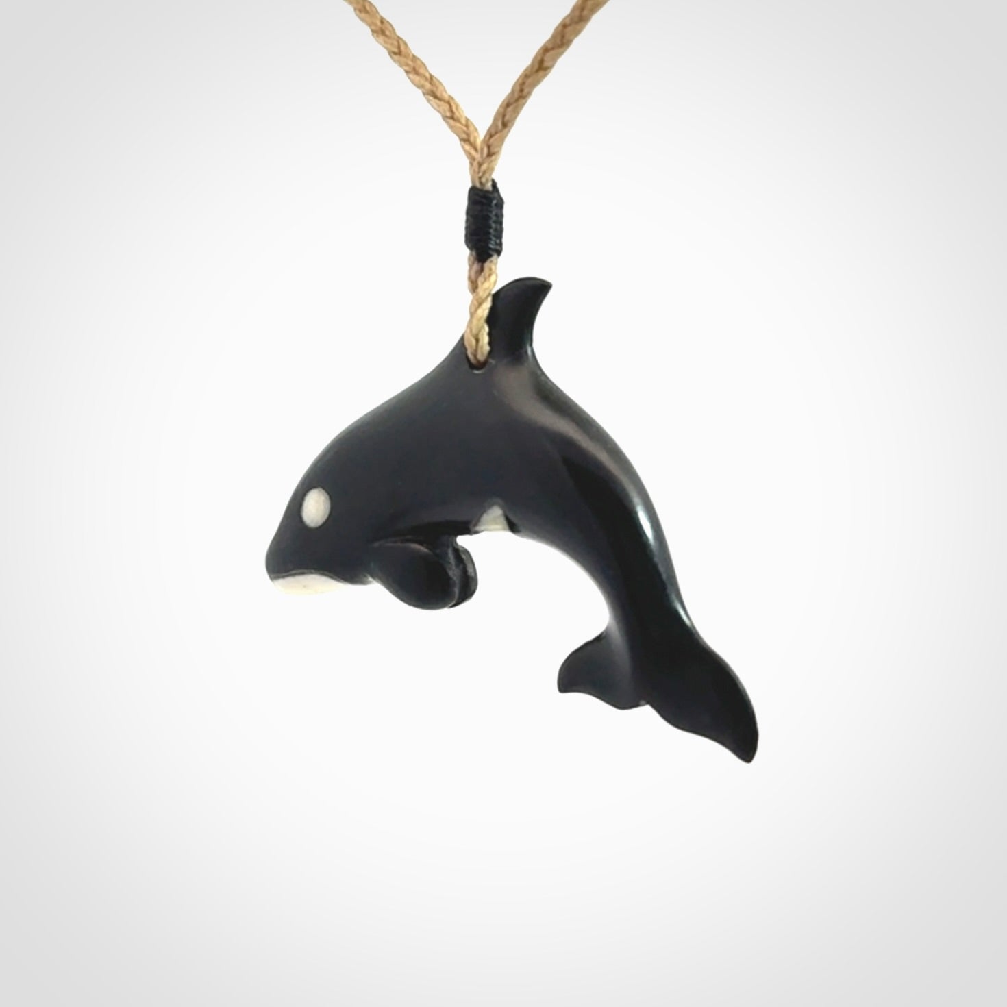 Hand carved black jade and bone Orca pendant. Ocean themed pendants hand carved from natural materials by NZ Pacific. Unique handmade jewellery.