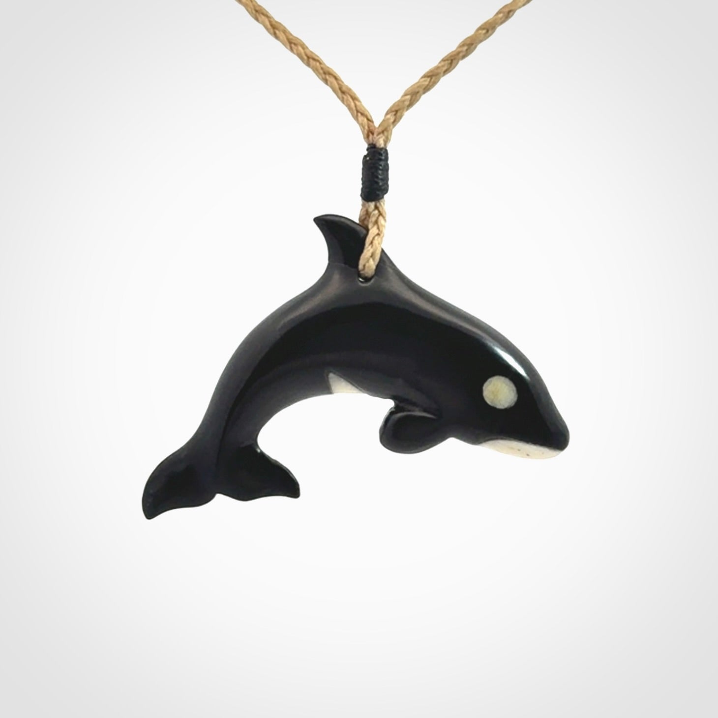 Hand carved black jade and bone Orca pendant. Ocean themed pendants hand carved from natural materials by NZ Pacific. Unique handmade jewellery.