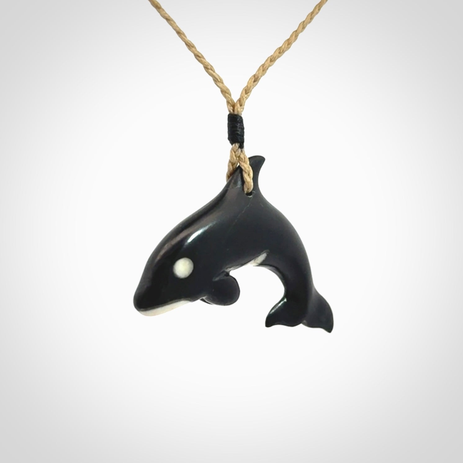 Hand carved black jade and bone Orca pendant. Ocean themed pendants hand carved from natural materials by NZ Pacific. Unique handmade jewellery.