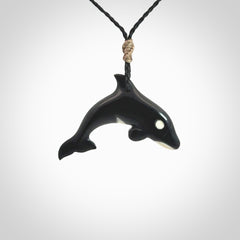 Hand carved black jade and bone Orca pendant. Ocean themed pendants hand carved from natural materials by NZ Pacific. Unique handmade jewellery.