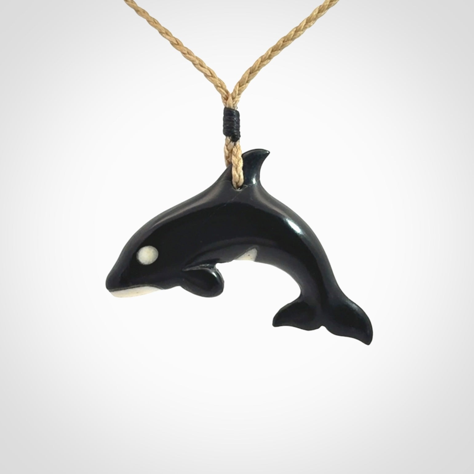 Hand carved black jade and bone Orca pendant. Ocean themed pendants hand carved from natural materials by NZ Pacific. Unique handmade jewellery.