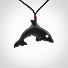 Hand carved black jade and bone Orca pendant. Ocean themed pendants hand carved from natural materials by NZ Pacific. Unique handmade jewellery.