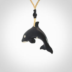 Hand carved black jade and bone Orca pendant. Ocean themed pendants hand carved from natural materials by NZ Pacific. Unique handmade jewellery.