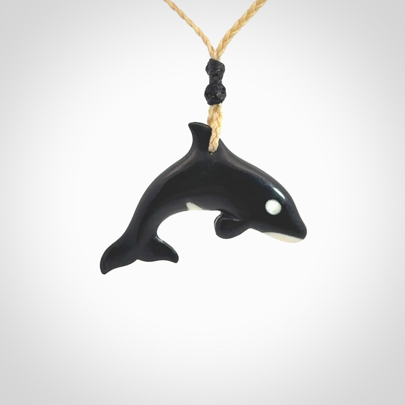 Hand carved black jade and bone Orca pendant. Ocean themed pendants hand carved from natural materials by NZ Pacific. Unique handmade jewellery.