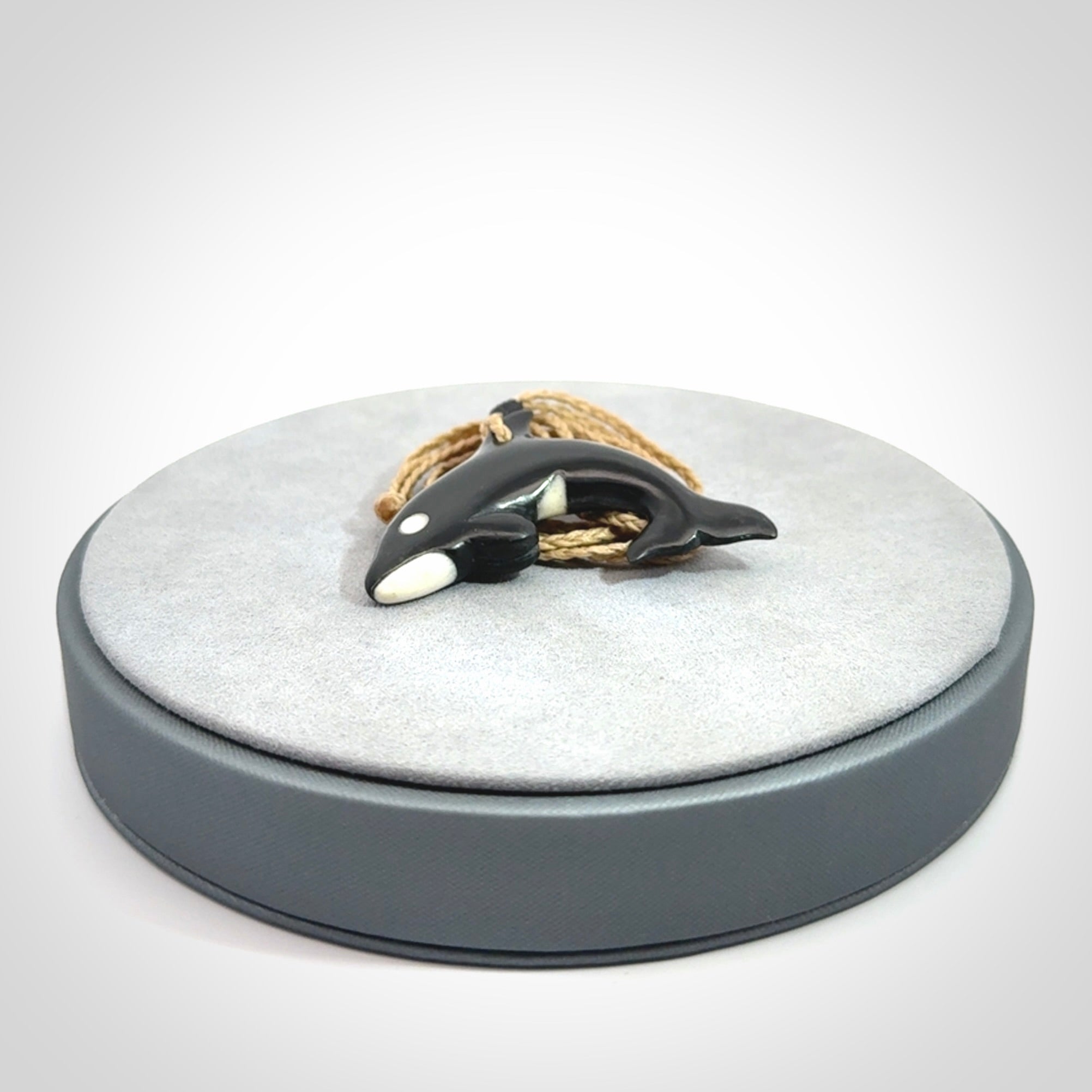 Hand carved black jade and bone Orca pendant. Ocean themed pendants hand carved from natural materials by NZ Pacific. Unique handmade jewellery.
