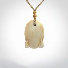 Hand carved incredible stained bone gargoyle face carving. A stunning work of art. This pendant was hand carved in bone with buffalo horn inlay for the eyes by Yuri Terenyi. A one off collectors item that has been hand crafted to be worn or displayed.