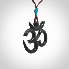 Hand carved black jade Om pendant. Carved from black jade by NZ Pacific. Unique, handmade jewellery for sale online.
