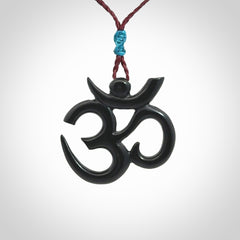 Hand carved black jade Om pendant. Carved from black jade by NZ Pacific. Unique, handmade jewellery for sale online.
