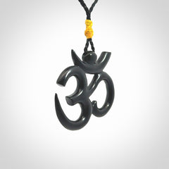 Hand carved black jade Om pendant. Carved from black jade by NZ Pacific. Unique, handmade jewellery for sale online.