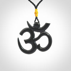 Hand carved black jade Om pendant. Carved from black jade by NZ Pacific. Unique, handmade jewellery for sale online.