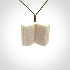 Hand carved open book pendant, hand made in bone.