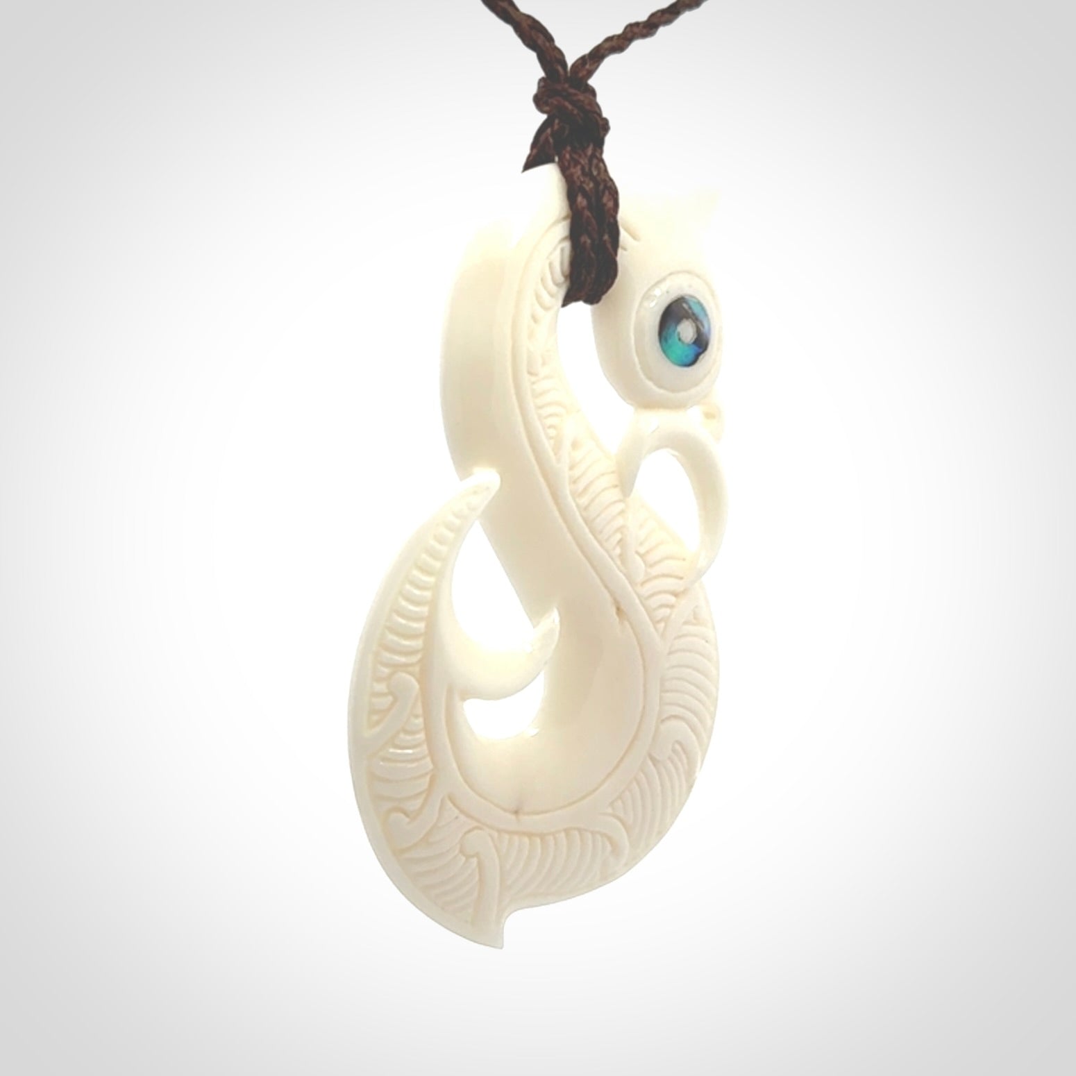 Hand carved bone manaia pendant. Made by NZ Pacific and for sale online. Free worldwide shipping.