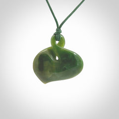 Hand carved New Zealand jade, single twist pendant. Maori pikorua pendant hand carved in New Zealand. Made by NZ Pacific, jade jewellery for sale online. One only hand made by Ross Crump.
