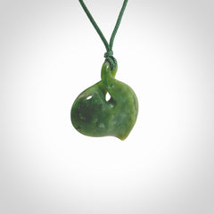Hand carved New Zealand jade, single twist pendant. Maori pikorua pendant hand carved in New Zealand. Made by NZ Pacific, jade jewellery for sale online. One only hand made by Ross Crump.