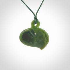 Hand carved New Zealand jade, single twist pendant. Maori pikorua pendant hand carved in New Zealand. Made by NZ Pacific, jade jewellery for sale online. One only hand made by Ross Crump.