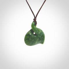 Hand carved New Zealand jade, single twist pendant. Maori pikorua pendant hand carved in New Zealand. Made by NZ Pacific, jade jewellery for sale online. One only hand made by Ross Crump.