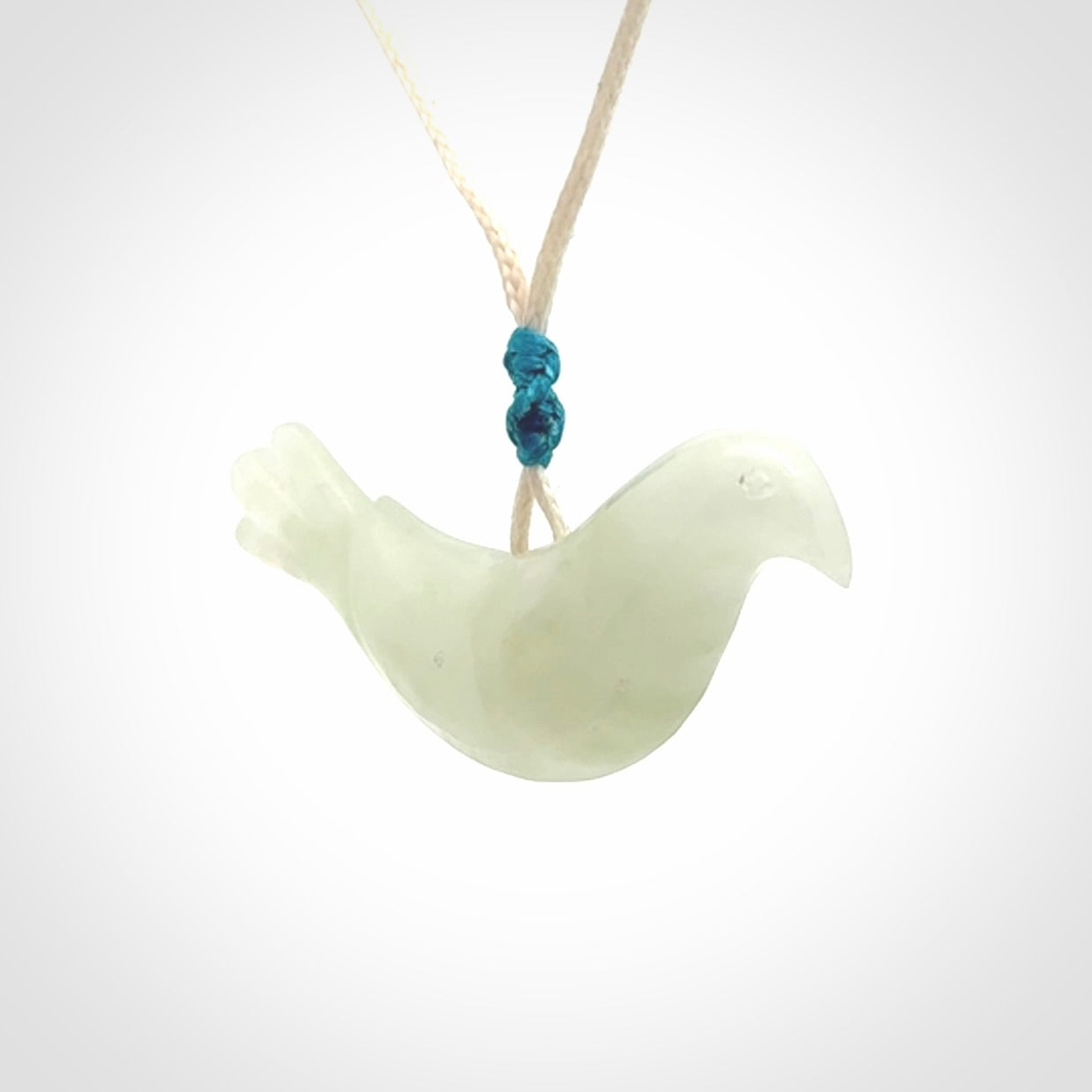 This pendant is a hand carved contemporary dove bird pendant. Carved in jadeite stone. It is a finely shaped piece with gentle and soft lines and is a great representation of the peace that doves traditionally represent. We ship these worldwide with express courier. A fantastic and meaningful gift.