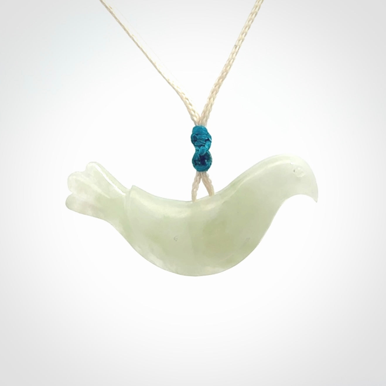 This pendant is a hand carved contemporary dove bird pendant. Carved in jadeite stone. It is a finely shaped piece with gentle and soft lines and is a great representation of the peace that doves traditionally represent. We ship these worldwide with express courier. A fantastic and meaningful gift.