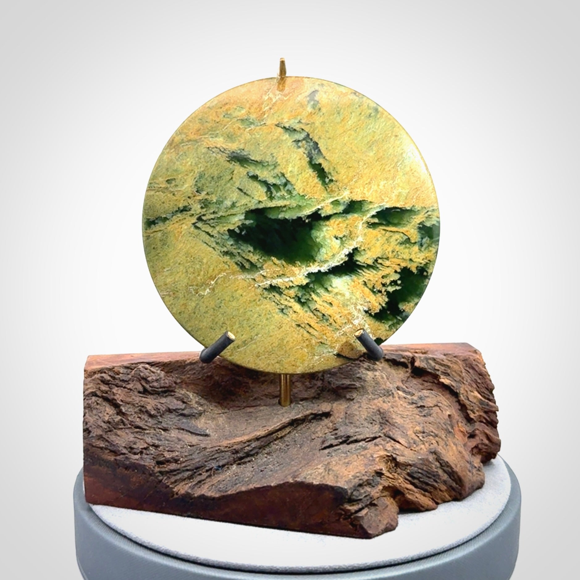 Hand carved New Zealand Flower Jade Disc with wooden stand sculpture. Hand carved here in New Zealand by Alex Sands Studio. This is a 'one only' sculpture, a beautiful display piece.
