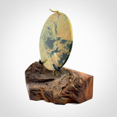 Hand carved New Zealand Flower Jade Disc with wooden stand sculpture. Hand carved here in New Zealand by Alex Sands Studio. This is a 'one only' sculpture, a beautiful display piece.