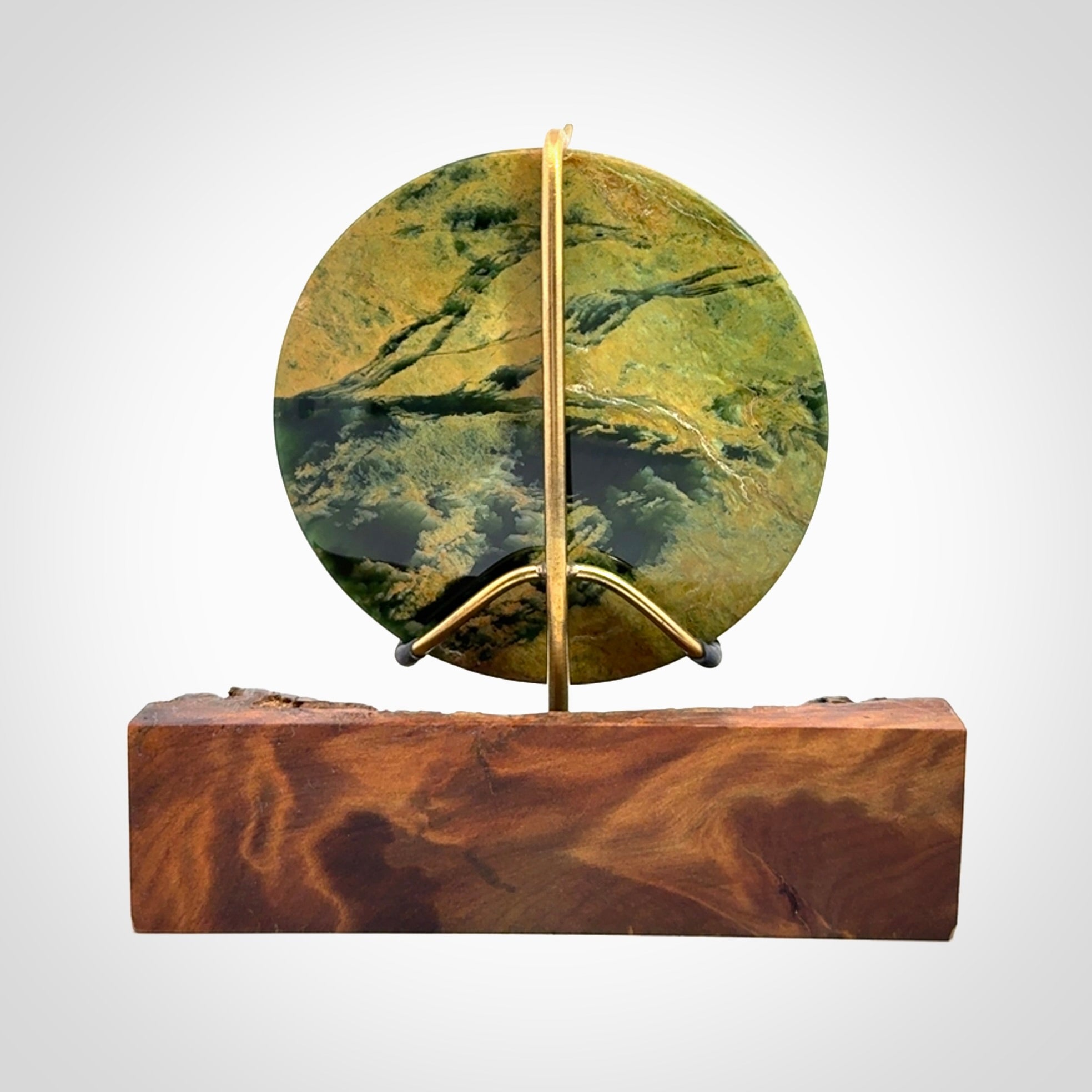 Hand carved New Zealand Flower Jade Disc with wooden stand sculpture. Hand carved here in New Zealand by Alex Sands Studio. This is a 'one only' sculpture, a beautiful display piece.