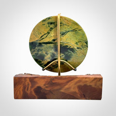 Hand carved New Zealand Flower Jade Disc with wooden stand sculpture. Hand carved here in New Zealand by Alex Sands Studio. This is a 'one only' sculpture, a beautiful display piece.