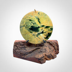 Hand carved New Zealand Flower Jade Disc with wooden stand sculpture. Hand carved here in New Zealand by Alex Sands Studio. This is a 'one only' sculpture, a beautiful display piece.