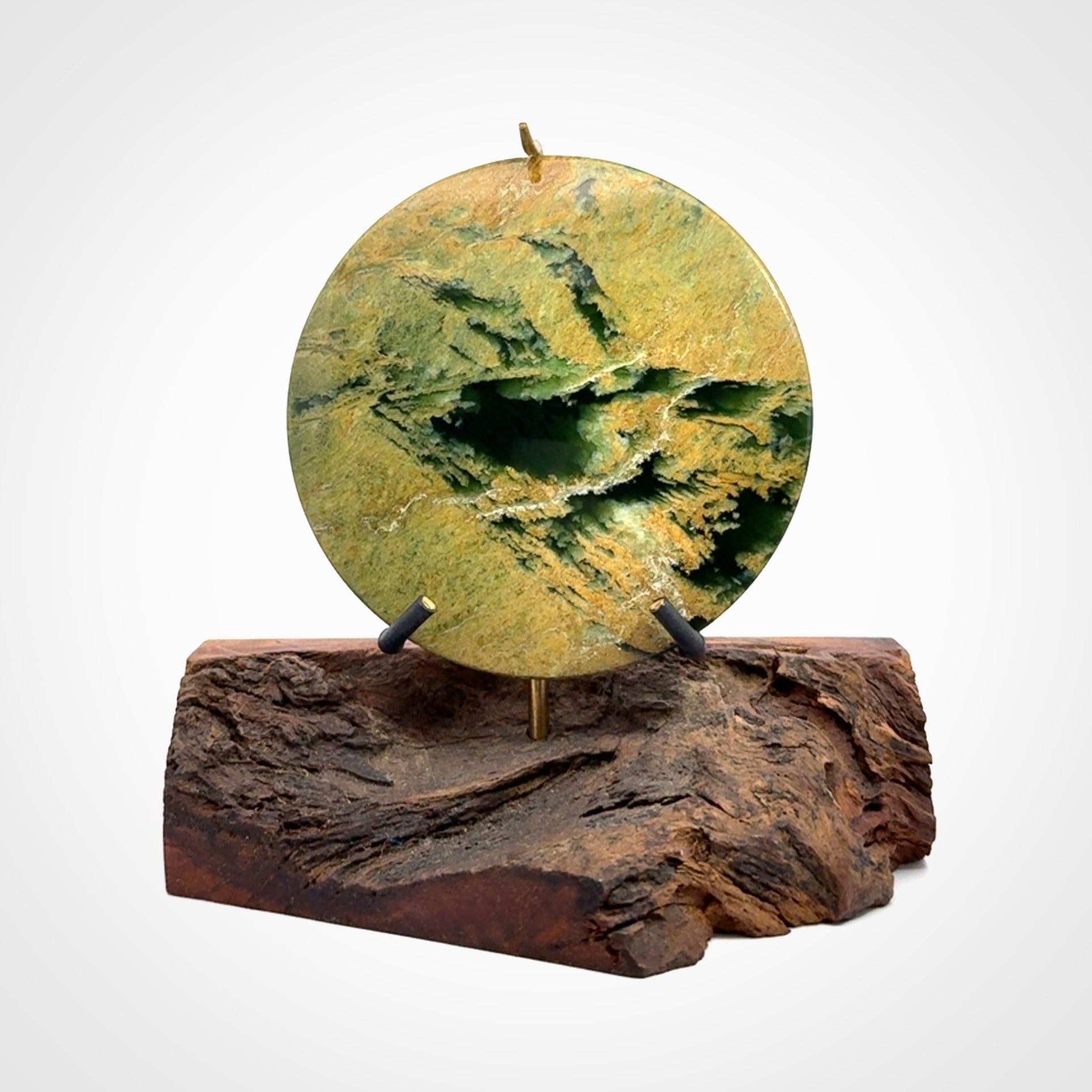 Hand carved New Zealand Flower Jade Disc with wooden stand sculpture. Hand carved here in New Zealand by Alex Sands Studio. This is a 'one only' sculpture, a beautiful display piece.
