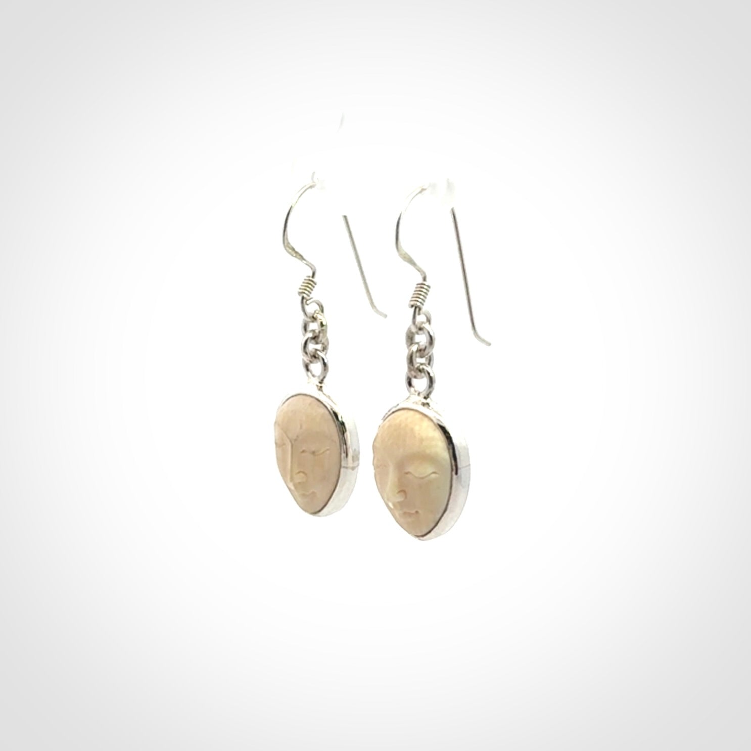 Hand carved Woolly Mammoth Tusk face earrings