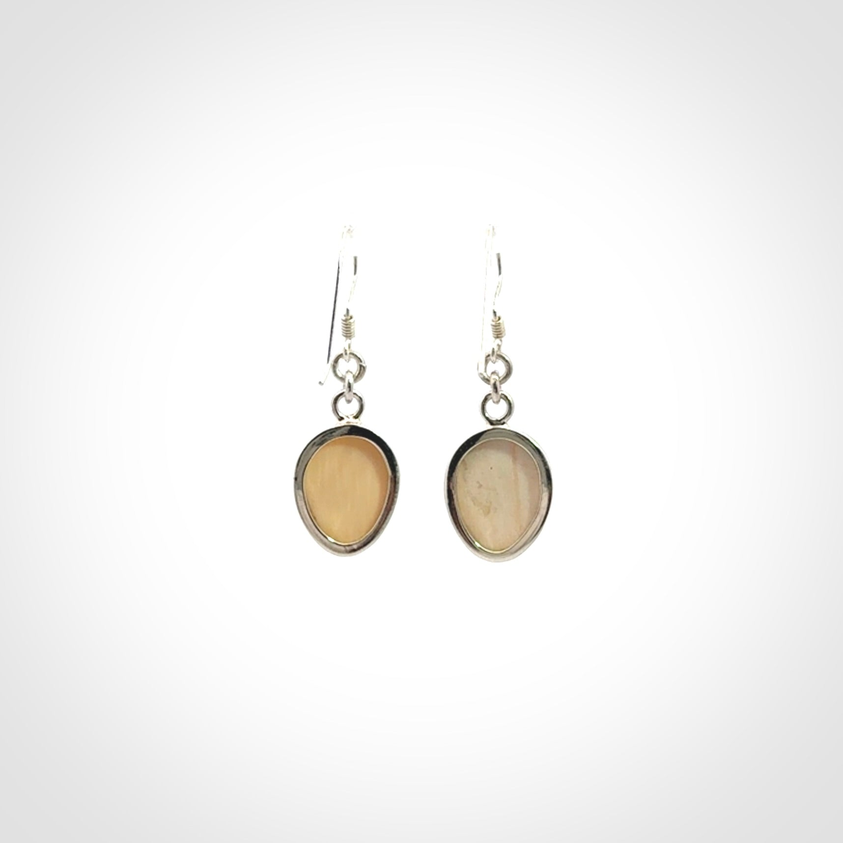 Hand carved Woolly Mammoth Tusk face earrings