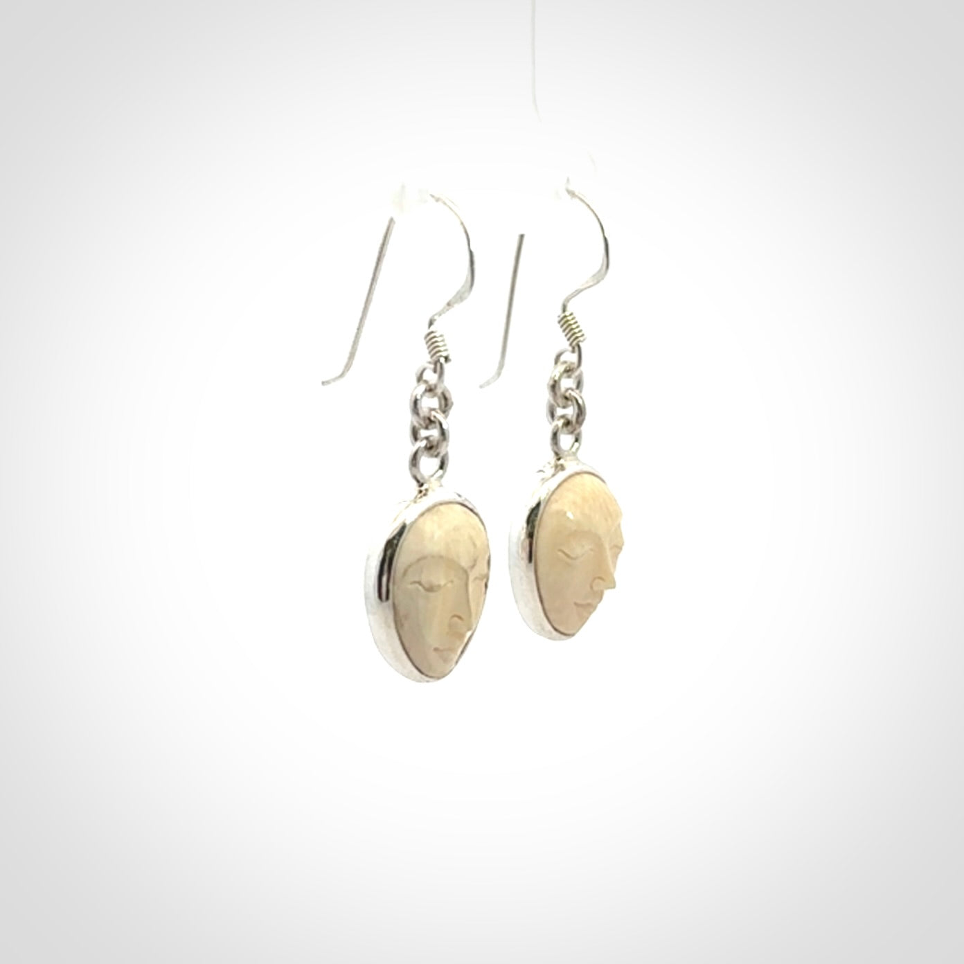 Hand carved Woolly Mammoth Tusk face earrings