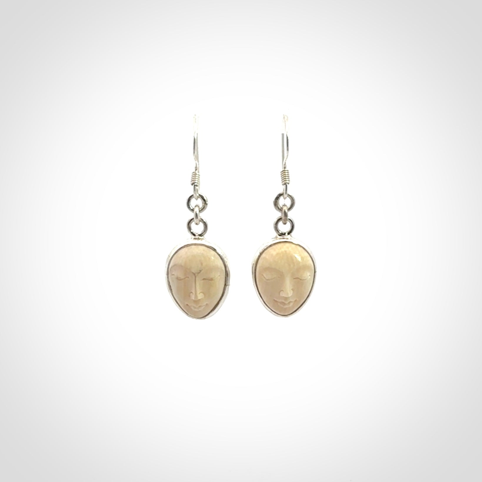 Hand carved Woolly Mammoth Tusk face earrings