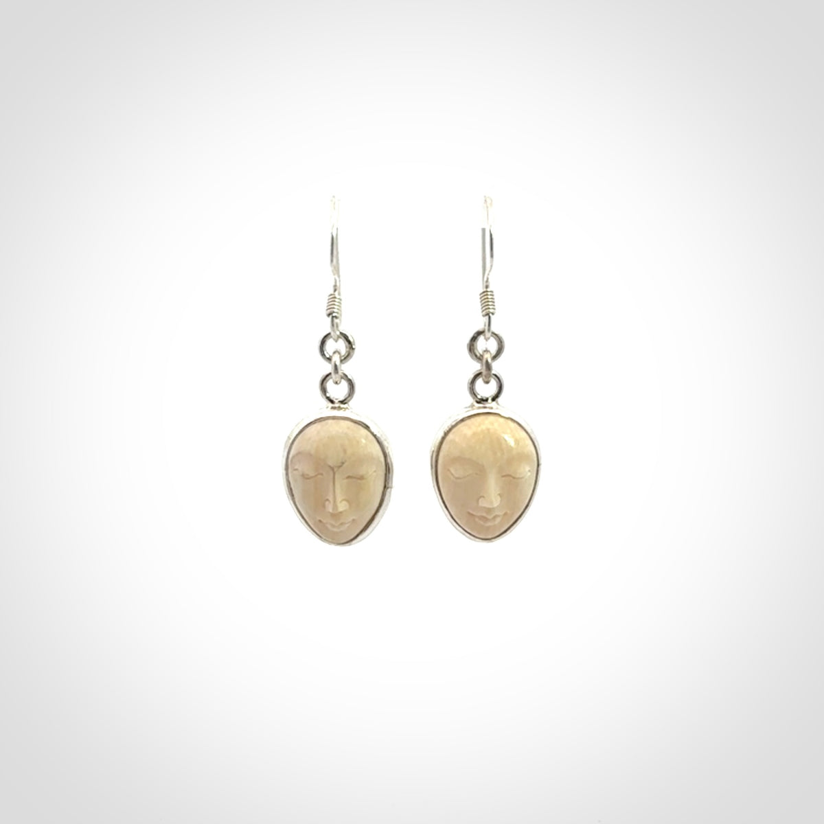 Hand carved Woolly Mammoth Tusk face earrings