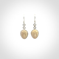 Hand carved Woolly Mammoth Tusk face earrings