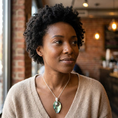 woman wearing Paua shell pendant