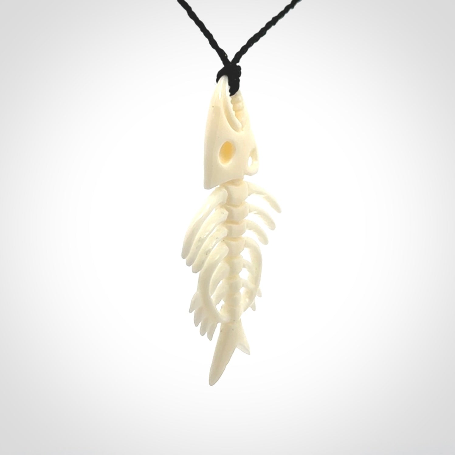 Hand carved bone fish skeleton pendant. Hand made bone fish necklace. Fish themed jewellery. Ocean themed pendant. One only necklace provided with adjustable cord and free delivery.