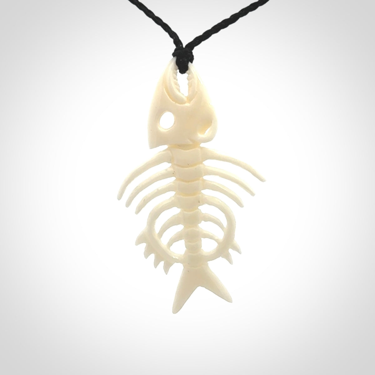 Hand carved bone fish skeleton pendant. Hand made bone fish necklace. Fish themed jewellery. Ocean themed pendant. One only necklace provided with adjustable cord and free delivery.
