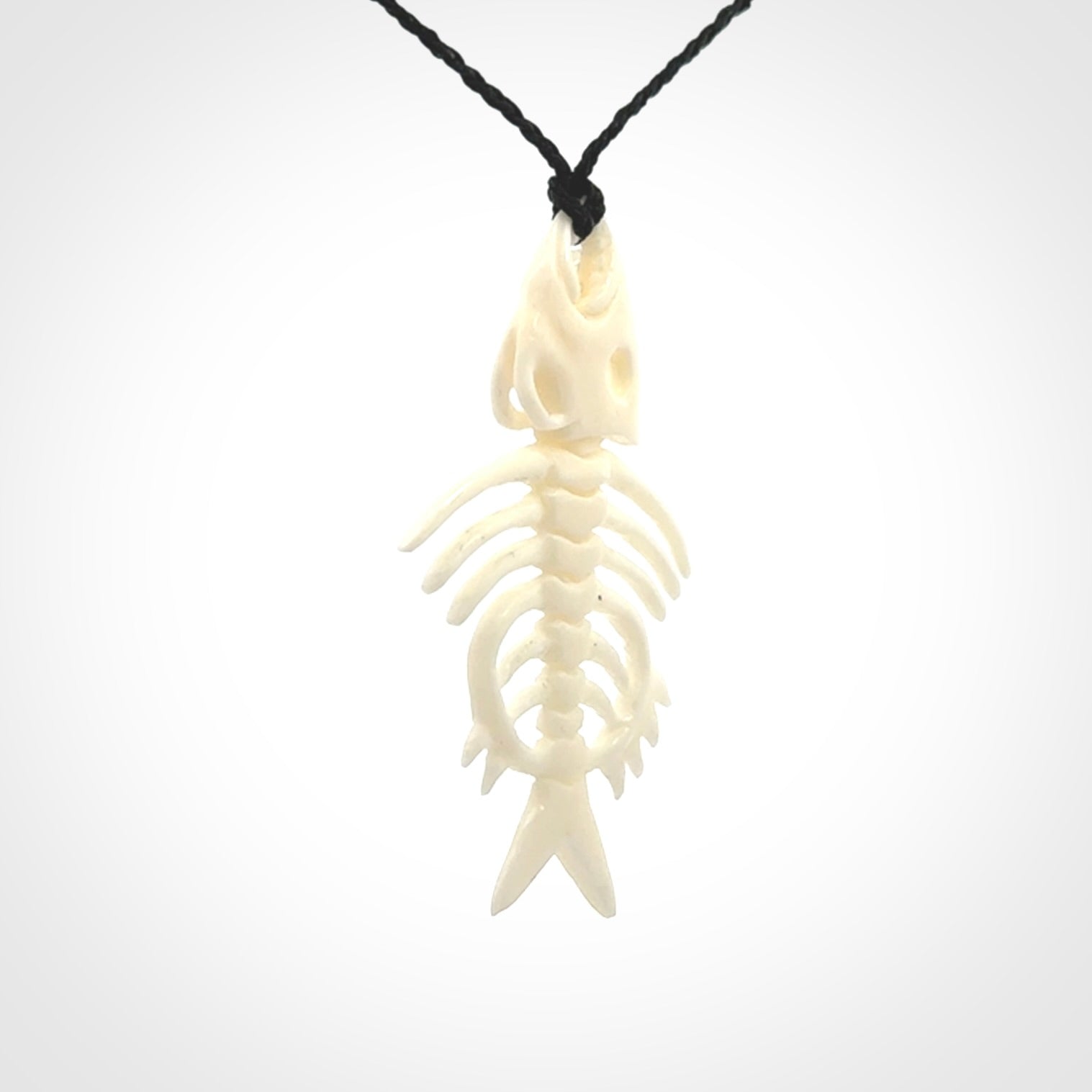 Hand carved bone fish skeleton pendant. Hand made bone fish necklace. Fish themed jewellery. Ocean themed pendant. One only necklace provided with adjustable cord and free delivery.