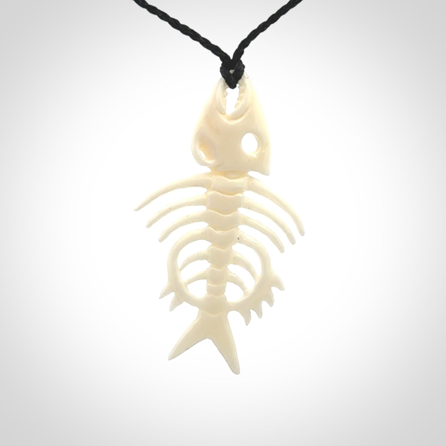 Hand carved bone fish skeleton pendant. Hand made bone fish necklace. Fish themed jewellery. Ocean themed pendant. One only necklace provided with adjustable cord and free delivery.