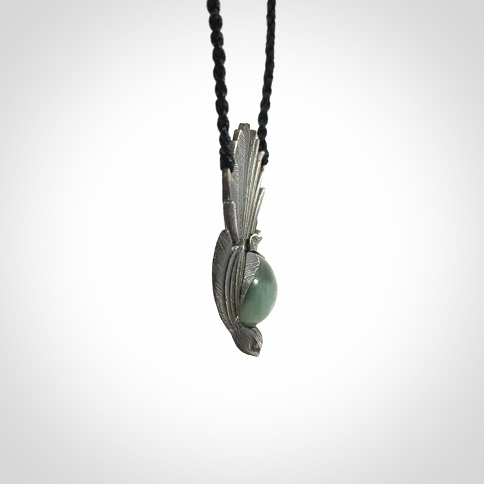 Hand crafted sterling silver fantail pendant with jade insert